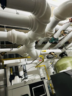 Mechanical room overhead insulated pipes