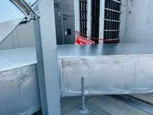 Rooftop insulated ductwork with safety signage